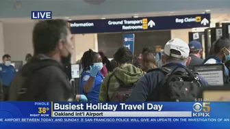 BUSY TRAVEL DAY:  Lines swelled at Oakland International Airport early Wednesday with holiday travel