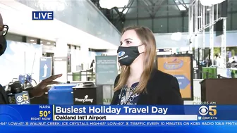 BUSY TRAVEL DAY:  Lines swelled at Oakland International Airport early Wednesday with holiday travel