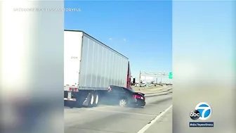 Video: Big rig drags car down highway with driver pinned underneath trailer l ABC7