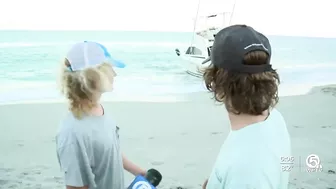 Migrants come ashore on beach in Jupiter