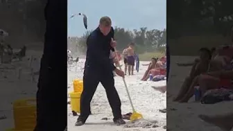 Janitor Mopping The beach