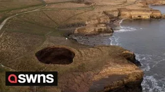 Drone footage shows a massive sinkhole revealing a hidden underground beach | SWNS