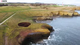 Drone footage shows a massive sinkhole revealing a hidden underground beach | SWNS