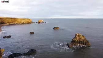 Drone footage shows a massive sinkhole revealing a hidden underground beach | SWNS