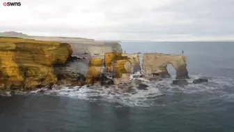 Drone footage shows a massive sinkhole revealing a hidden underground beach | SWNS