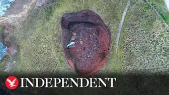 Huge sinkhole reveals hidden underground beach