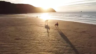 Horse Riding on the Beach at Sunset