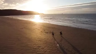 Horse Riding on the Beach at Sunset