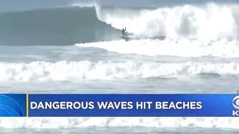 Powerful Surf Strikes Coast; Surfers At Ocean Beach Brave Dangerous Waves