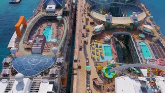 Oasis of the Sea and Celebrity Apex cruise ships docked next to each other - Aerial drone view