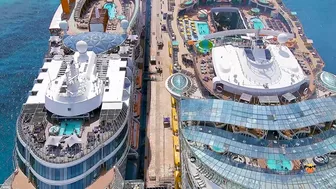 Oasis of the Sea and Celebrity Apex cruise ships docked next to each other - Aerial drone view