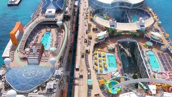 Oasis of the Sea and Celebrity Apex cruise ships docked next to each other - Aerial drone view