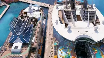 Oasis of the Sea and Celebrity Apex cruise ships docked next to each other - Aerial drone view