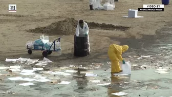 Workers scramble to clean oil slick from Thai beach