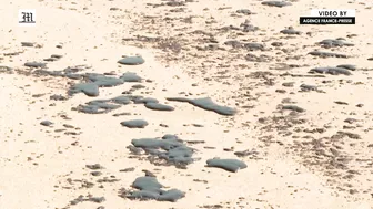 Workers scramble to clean oil slick from Thai beach