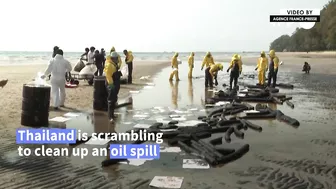 Workers scramble to clean oil slick from Thai beach