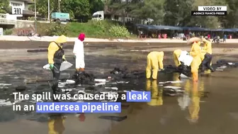 Workers scramble to clean oil slick from Thai beach