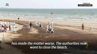 Workers scramble to clean oil slick from Thai beach