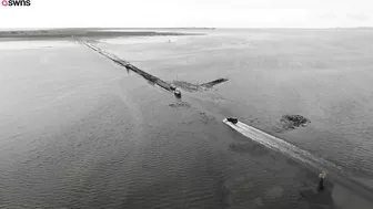 Artist uses RAKE to recreate 123-year-old masterpiece on deserted beach | SWNS