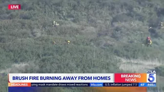 Evacuations remain as brush fire burns near Laguna Beach