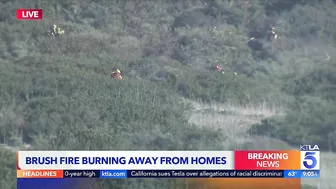 Evacuations remain as brush fire burns near Laguna Beach