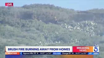 Evacuations remain as brush fire burns near Laguna Beach