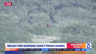 Evacuations remain as brush fire burns near Laguna Beach