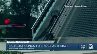 Bicyclist clings to rising North Palm Beach drawbridge