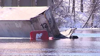 Crash into Charles: Driver rescued after tractor-trailer carrying US mail ends up in river