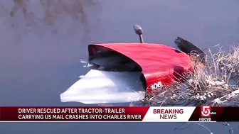 Crash into Charles: Driver rescued after tractor-trailer carrying US mail ends up in river