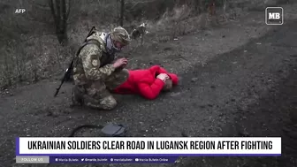 Ukrainian soldiers clear road in Lugansk region after fighting