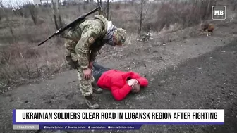 Ukrainian soldiers clear road in Lugansk region after fighting