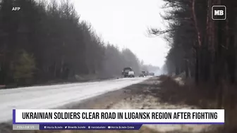 Ukrainian soldiers clear road in Lugansk region after fighting