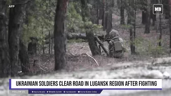 Ukrainian soldiers clear road in Lugansk region after fighting