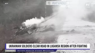 Ukrainian soldiers clear road in Lugansk region after fighting