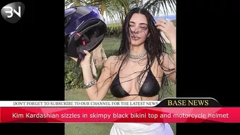 Kim Kardashian sizzles in skimpy black bikini top and motorcycle helmet