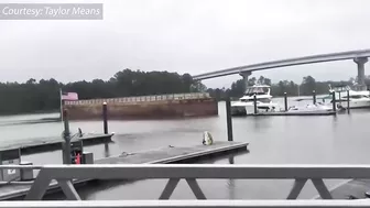 Caught on Camera: Runaway barge has close encounter with Orange Beach toll bridge