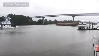 Caught on Camera: Runaway barge has close encounter with Orange Beach toll bridge