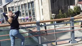 Stretching near river on the bridge