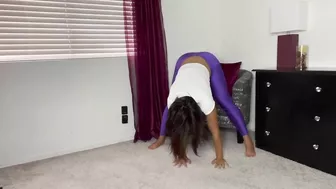 Stretching in shiny purple tights