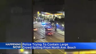 Police try to contain crowd that spilled over from North Avenue Beach