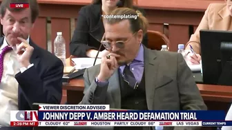 Johnny depp's lawyer steals his candy in court... (funny)