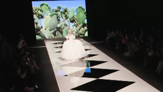 Model FALLS in wedding dress during Amelia Casablanca Bridal Couture Spring/Summer 2022 Fashion Show