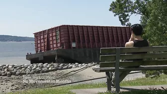 Barge beached in Vancouver’s English Bay not budging