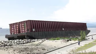 Barge beached in Vancouver’s English Bay not budging