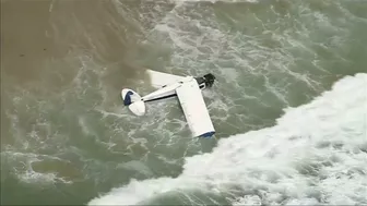 Watch: Beachgoers capture small plane crash in ocean at Huntington Beach