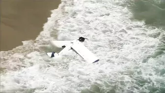 Watch: Beachgoers capture small plane crash in ocean at Huntington Beach