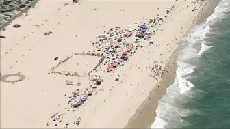 Watch: Beachgoers capture small plane crash in ocean at Huntington Beach