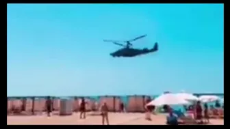 The Passage Of An Helicopter "Alligator" Over A Beach In Krim.