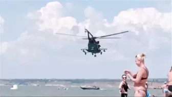 The Passage Of A Russia’s Helicopters Over A Beach Low Altitude